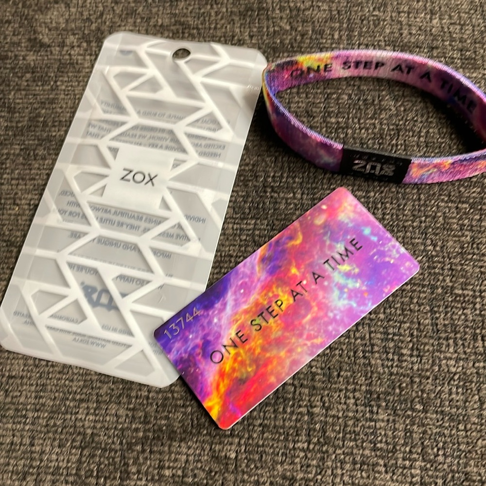 Zox wristband and plastic card can carry in wallet or purse